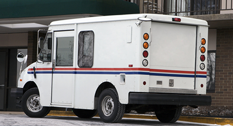 White postal service truck
