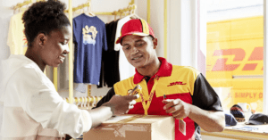 DHL man delivering a package and woman signing