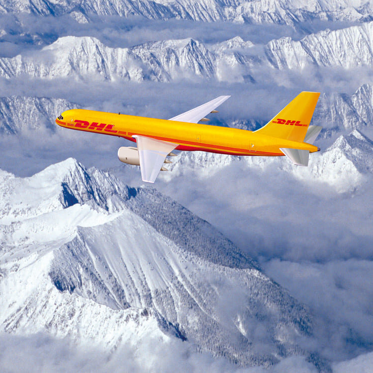 DHL Plane flying over iced mountains